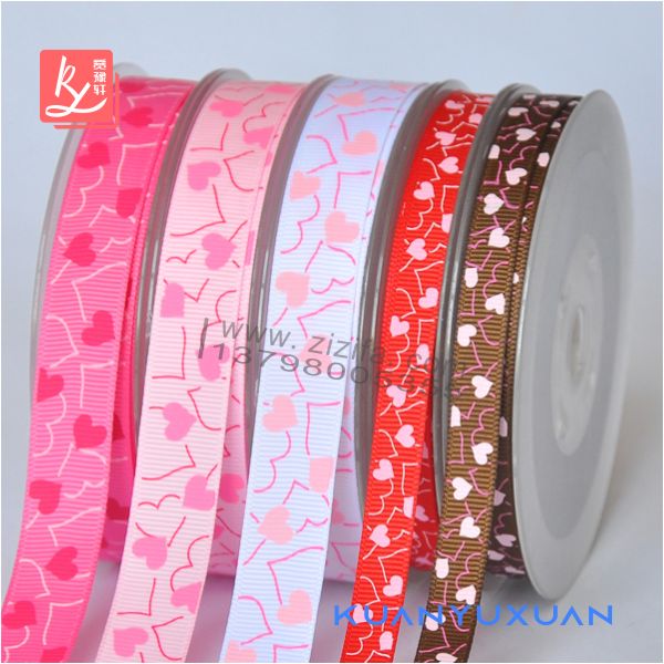 Multiple colors of grosgrain ribbon imprinted with hearts